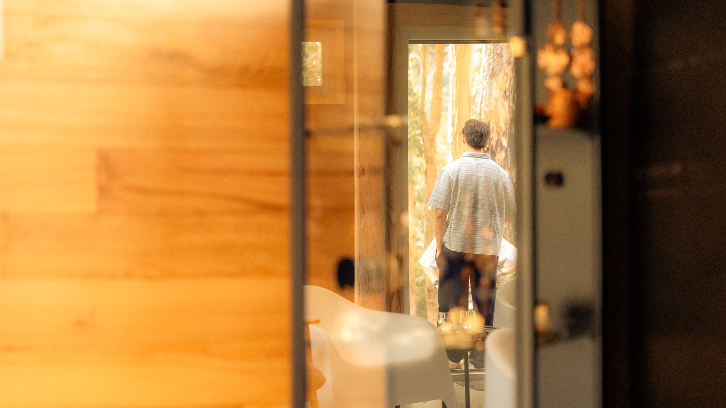 Participant in conversation — warm interior light
