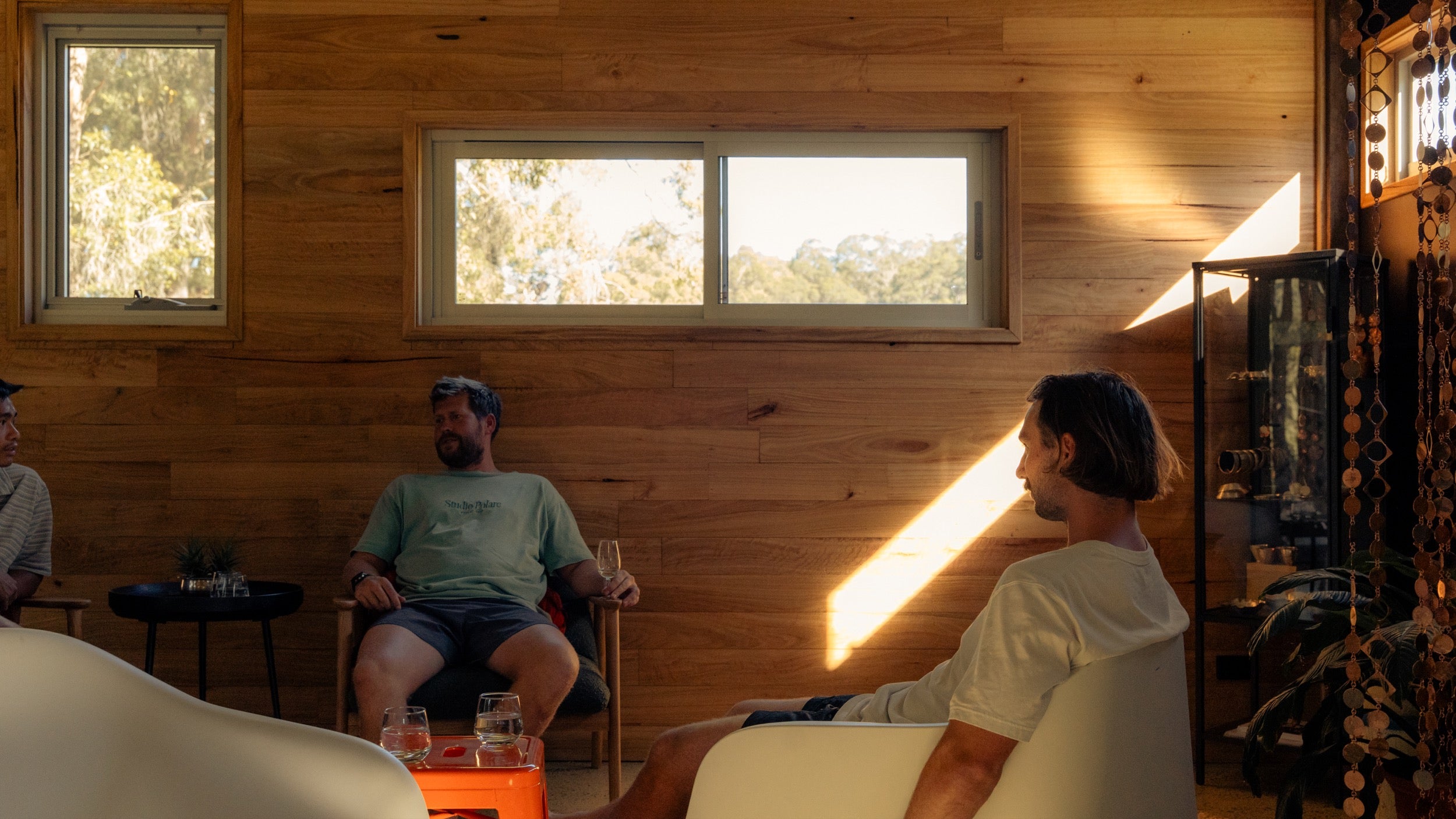 Participant reflected in glass, forest beyond